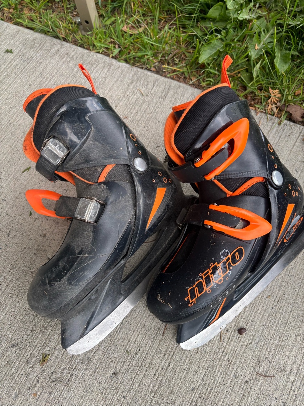 Kids' Black and Orange Adjustable Ice Skates